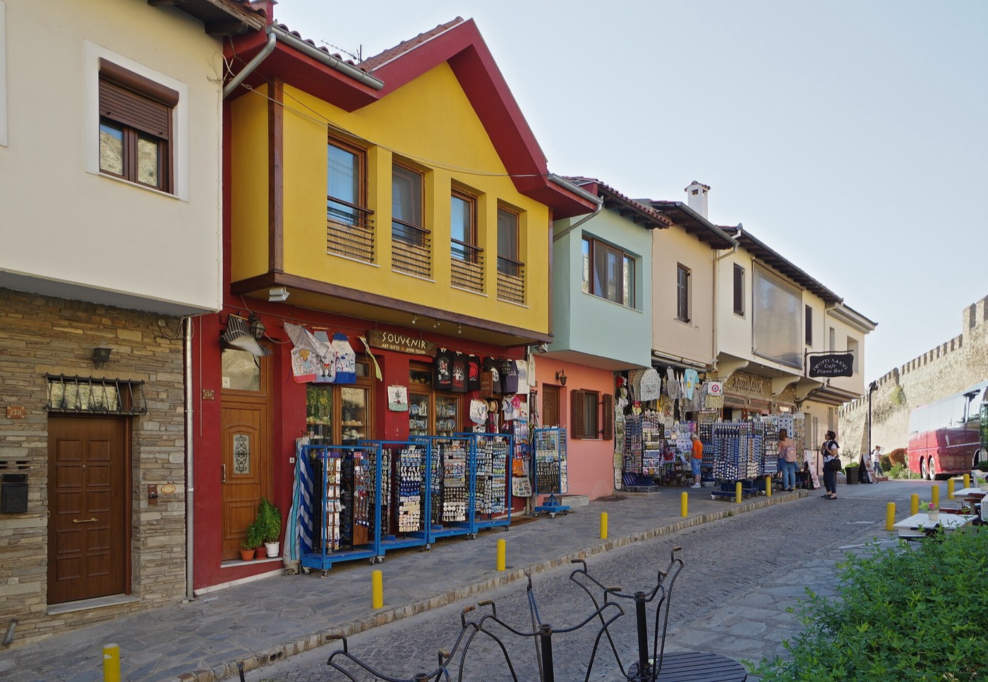 Colourful traditional houses and souvenir shops along the walls in Ano Poli